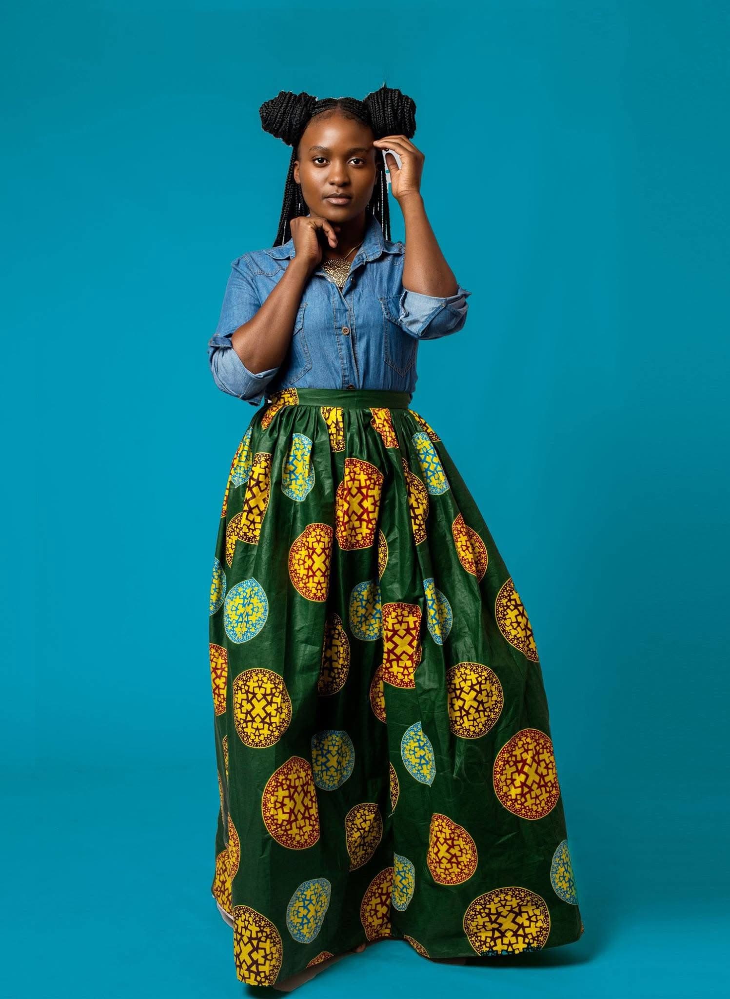Model wearing a green African print Hartbrooks skirt